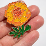 Pin taget clavel extrangero naranja