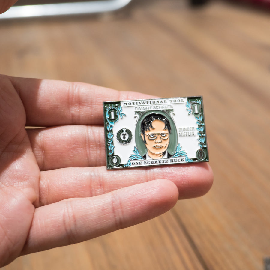 Pin de un dólar de Dwight